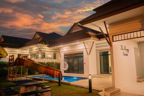 a house with a slide in front of it at so happy pool villa hua hin in Ban Bo Fai (1)