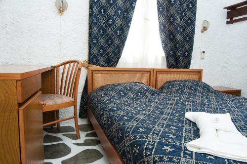Postel nebo postele na pokoji v ubytování Manousos' Rooms