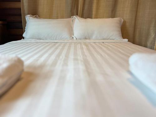 Postel nebo postele na pokoji v ubytování Srisanor Boutique Hotel