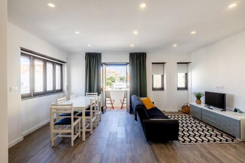 a living room with a couch and a table at Holy Escape in Santa Cruz