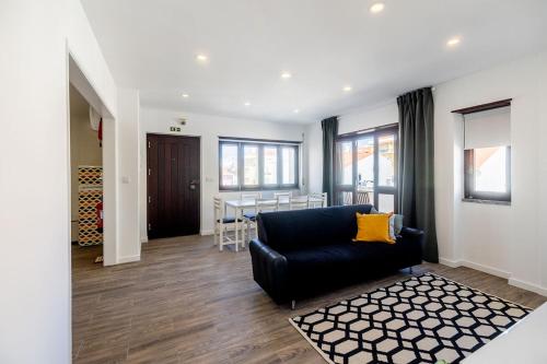 a living room with a couch and a table at Holy Escape in Santa Cruz