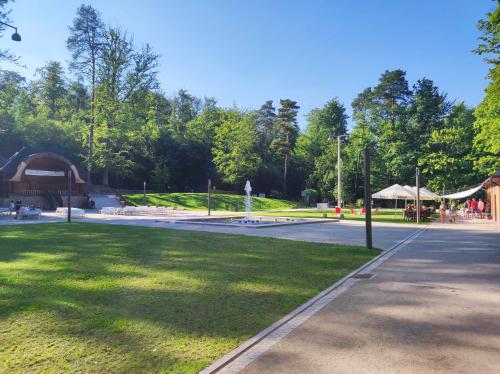 a park with a grass field and a pavilion at Apartament ''Na Szlaku'' in Głuchołazy