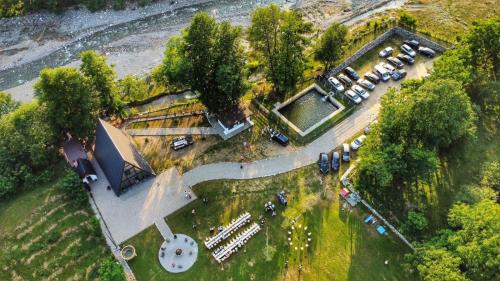 an aerial view of a park with parked cars at Cabana A Vaideeni in Vaideeni
