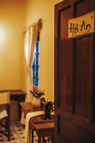 a door with a sign on it in a room at Lagi Retreat homestay Home ngay mặt biển Lagi in La Gi