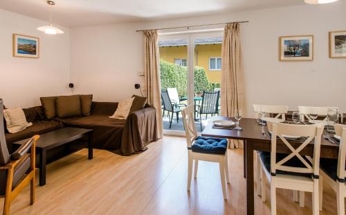 a living room with a couch and a table at Chalet Vergissmeinnicht in Zell am See