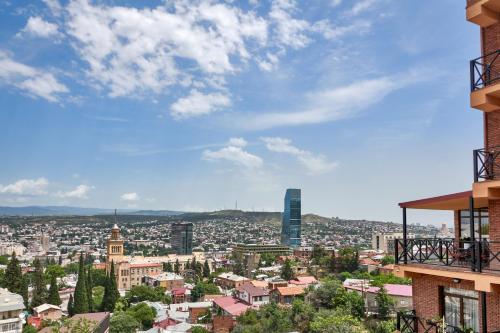a view of a city from a building at GINGER Hotel in Tbilisi City