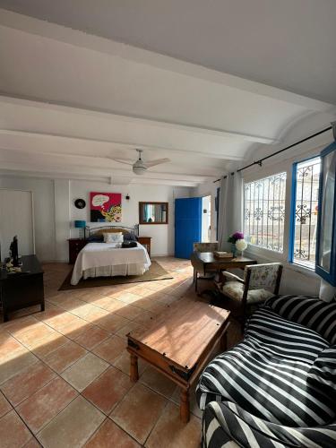 a living room with a bed and a table at Loft en Mojácar in Mojácar