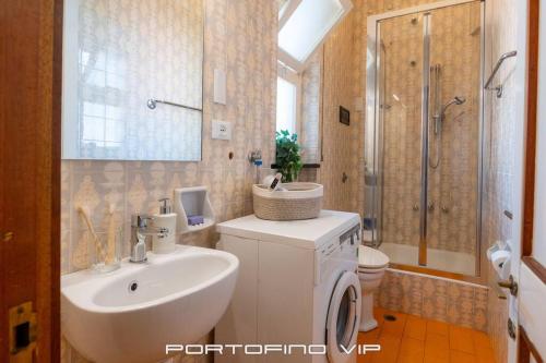 a bathroom with a sink and a toilet and a shower at Appartamento Via Madonnetta by PortofinoVip in Santa Margherita Ligure