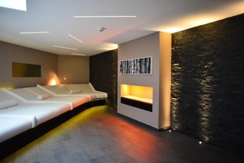 a room with two beds and a fireplace at Schloss Reinach in Freiburg im Breisgau