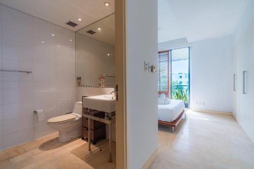 a bathroom with a toilet and a sink and a shower at Park view Avalon Apartment District 1 HCM City in Ho Chi Minh City