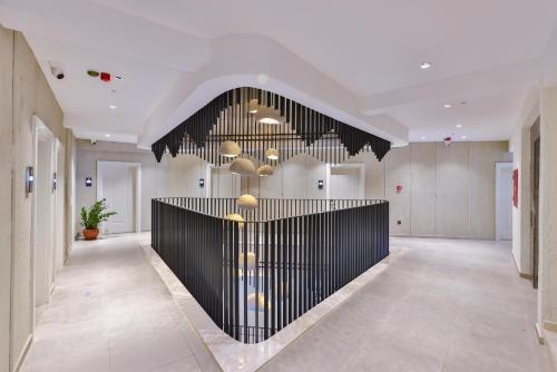 a large hallway with a lobby with a black wall at Kas Athena Hotel in Kas
