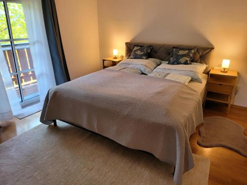 a bedroom with a large bed with two pillows at Appartemens Marianne in Grossgmain