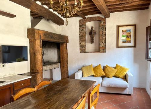 a living room with a couch and a table at Fattoria La Loggia in San Casciano in Val di Pesa