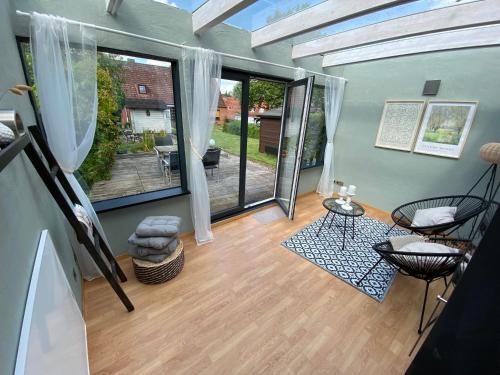 a living room with a view of a patio at Haus No. 16 in Ratzeburg