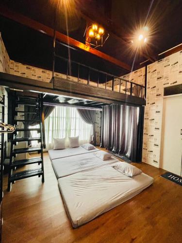 a bedroom with two bunk beds in a room at Skeyndor Health & Resort in Na Jomtien