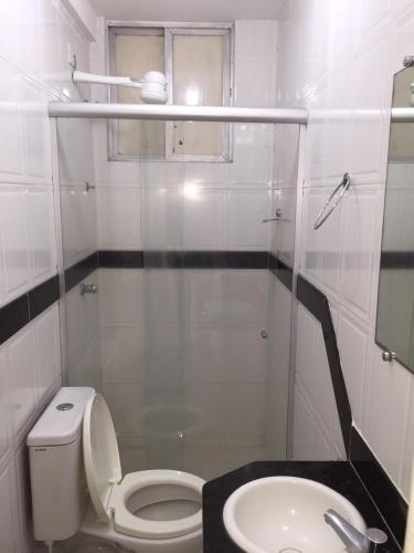 a small bathroom with a toilet and a sink at Hotel Piramide St. Antonio de Jesus in Santo Antônio de Jesus