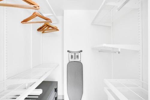 a white kitchen with a skateboard in the middle at Lovely Beacon Hill 1BR BOS-696 in Boston