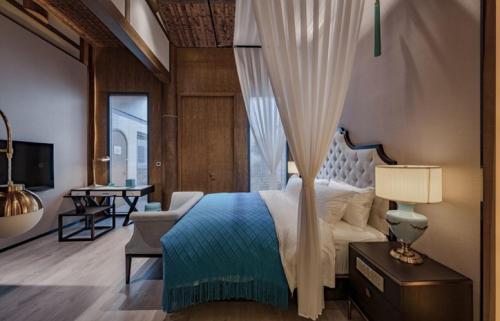 Ένα ή περισσότερα κρεβάτια σε δωμάτιο στο Fuzhou TAIYIN Albar Hotel