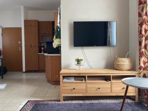 a living room with a flat screen tv on a wall at Appartement GIUDECCA in Venice