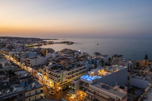 an aerial view of a city at night at San Antonio Boutique Hotel & Spa - Adults Only in Hersonissos