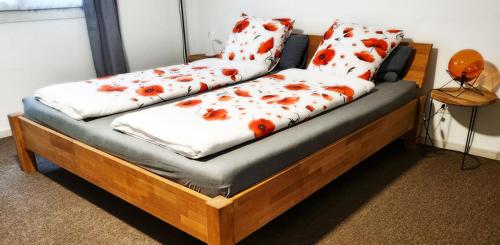 a bed with two pillows on top of it at Treffpunkt Heuwiese in Weite