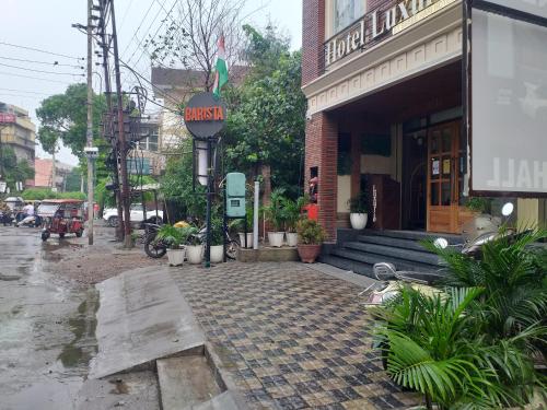 a cobblestone street in front of a building at Hotel Luxurio - In-House Barista Cafe, Near Golden Temple Amritsar in Amritsar