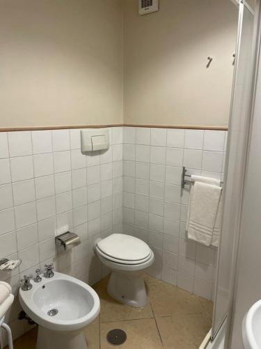 a bathroom with a toilet and a sink at Casa Vacanze La Villetta in Montefranco