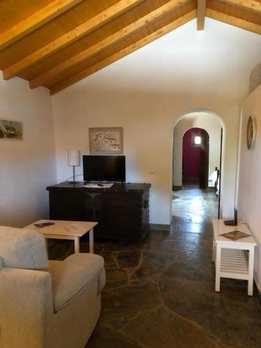 a living room with a couch and a table at Casa do Forno Évora retreat in Redondo
