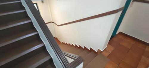 an overhead view of a stairwell with a stair tread at The Boat Jetty Bungalow in Cochin