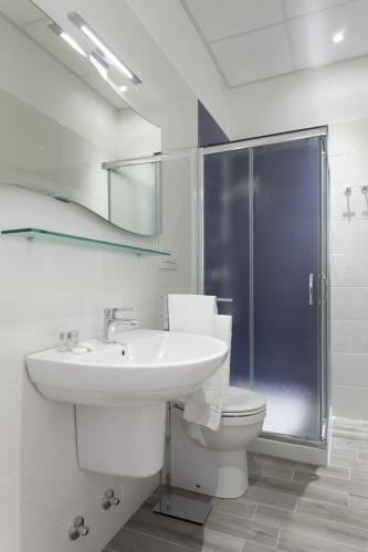 a bathroom with a sink and a toilet and a shower at Costa Azzurra Gallipoli in Gallipoli