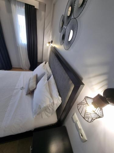 Ένα ή περισσότερα κρεβάτια σε δωμάτιο στο GreenHill Holiday Suites