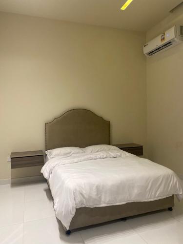 Ένα ή περισσότερα κρεβάτια σε δωμάτιο στο Rateel Apartments