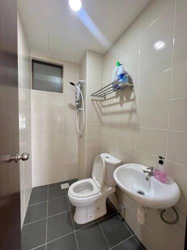 a bathroom with a toilet and a sink at MuciHome 3R2B Residensi Zamrud, Kajang 2, Bandar Baru Bangi - non smoking sweethome for Malaysian and Borneo Guests only in Kajang