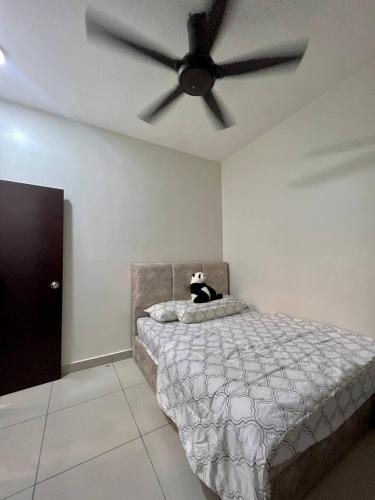 a bedroom with a bed with a ceiling fan at MuciHome 3R2B Residensi Zamrud, Kajang 2, Bandar Baru Bangi - non smoking sweethome for Malaysian and Borneo Guests only in Kajang