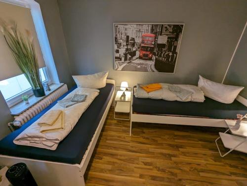 Een bed of bedden in een kamer bij Flensburg Zentrum 50