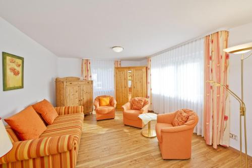 a living room with two couches and two chairs at Hotel Bären in Rottweil