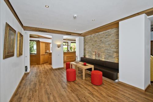 a living room with a couch and a table at Hotel Bären in Rottweil