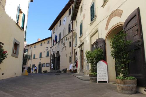 an empty street in a town with buildings at Heart of Chianti - a warm flat in Radda in Radda in Chianti