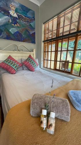 Una cama o camas en una habitación de Hidden Gem Art Guesthouse , one of a kind