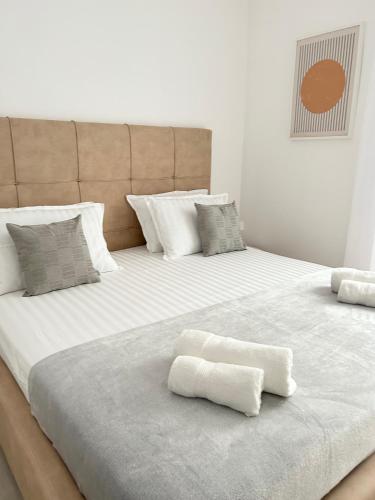 a large white bed with two white pillows on it at Aurus 2 in Korčula