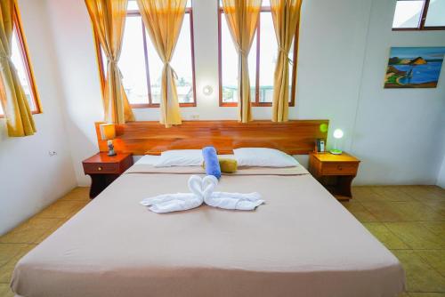 Cama o camas de una habitación en Galapagos Verde Azul