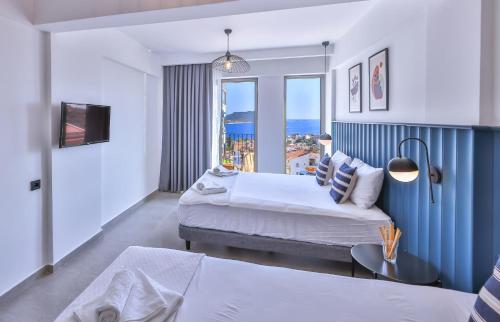 Postel nebo postele na pokoji v ubytování Aphrodite Hotel Kaş