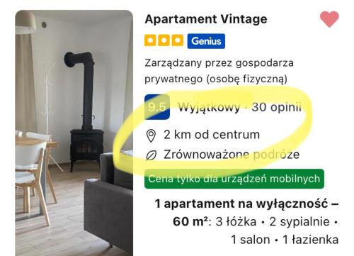 a page of a website with a room with a fireplace at Apartament Vintage in Mrągowo