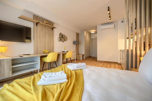 a hotel room with a bed and a kitchen at AboutArtApartments - Otyńska 4 in Wrocław