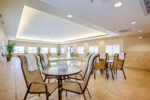 a dining room with a table and chairs at Hampton Inn & Suites Pinedale in Pinedale