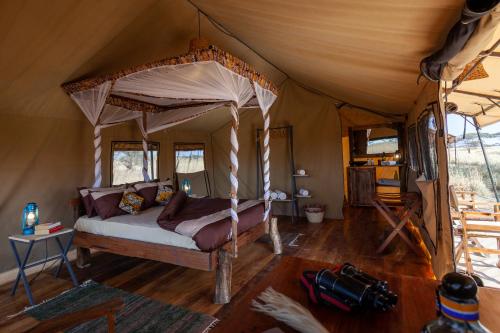 Postel nebo postele na pokoji v ubytování Mawe Tented Camp