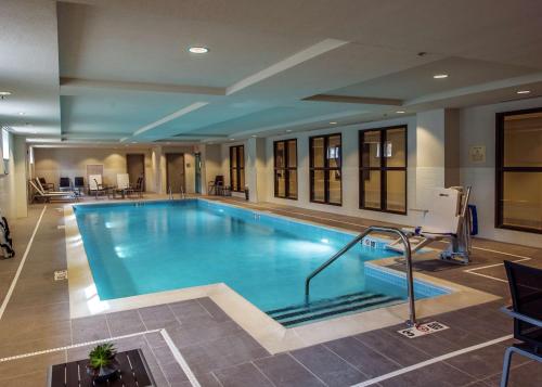 a large swimming pool in a hotel room at Hampton Inn & Suites/Foxborough/Mansfield in Foxborough
