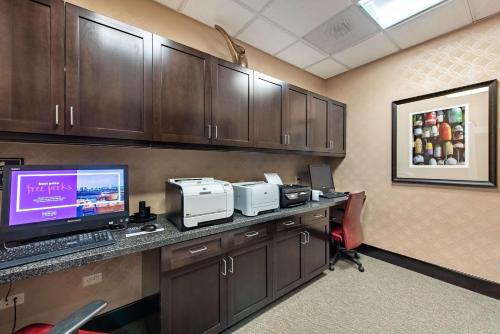 a conference room with a desk with a computer on it at Homewood Suites by Hilton Oxnard/Camarillo in Oxnard