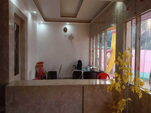 a kitchen with a counter top in a room at OYO Hotel K2 in Bihta