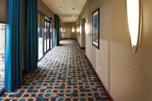 a hallway of a hospital with a tile floor at DoubleTree by Hilton Murfreesboro in Murfreesboro